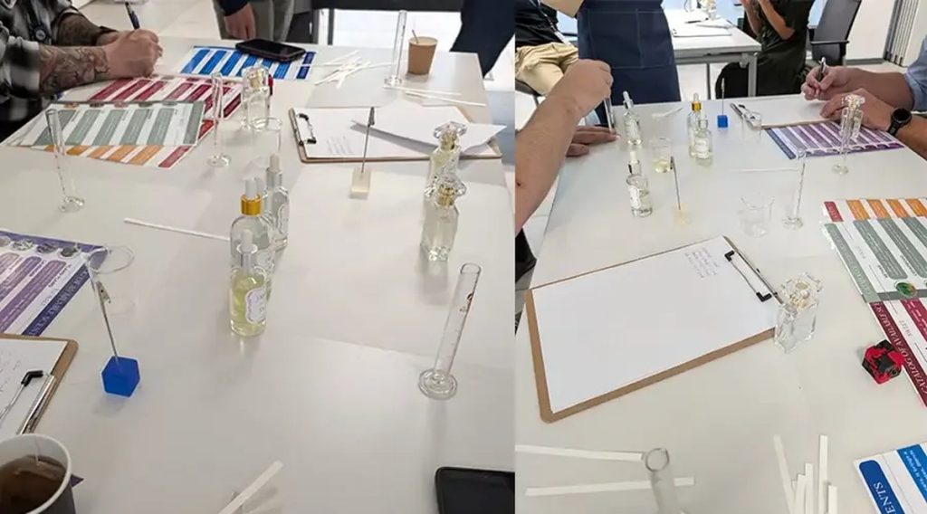 Regalos originales para empresas: mesa del taller de perfumes con probetas, esencias y fichas por equipo