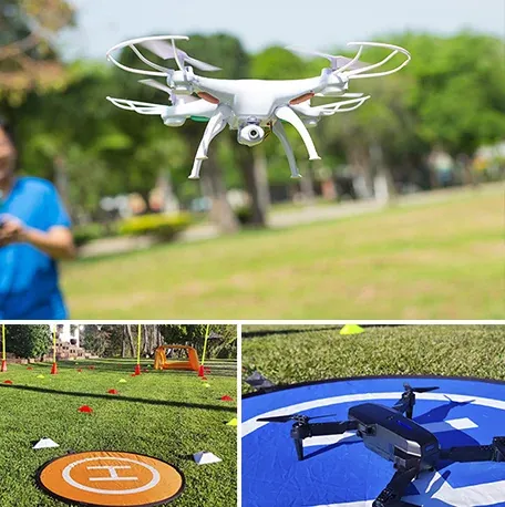 Dron blanco volando en un parque junto a un circuito con pista de aterrizaje