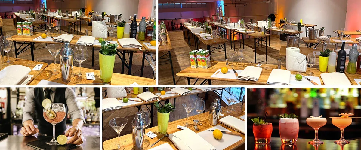 Sala montada con puestos de coctelería, copas preparadas y cócteles terminados sobre la barra