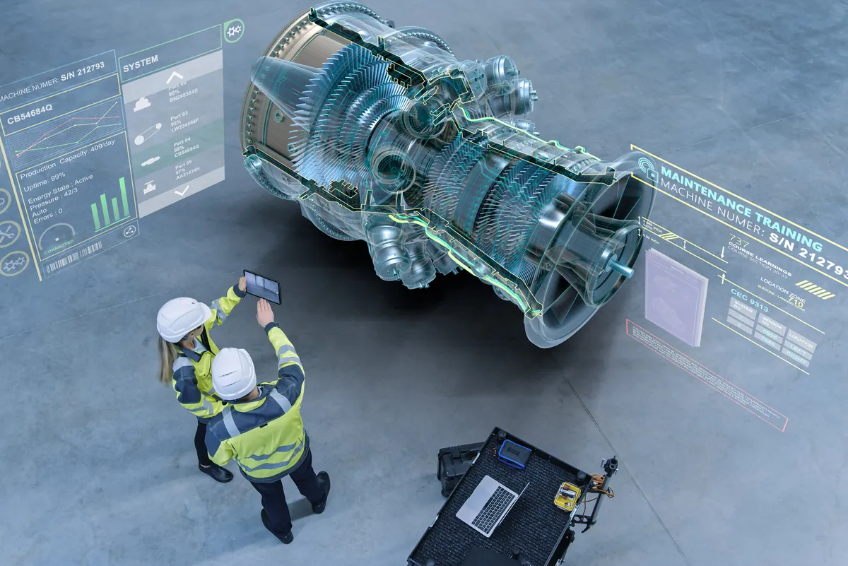 Técnicos con casco analizan una turbina en realidad aumentada rodeada de paneles de datos